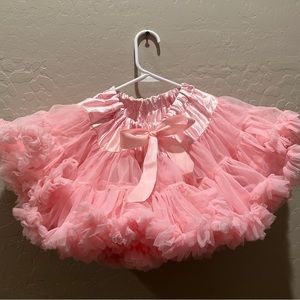 Girls, light pink fluffy tutu will fit a 3 to 5 year old